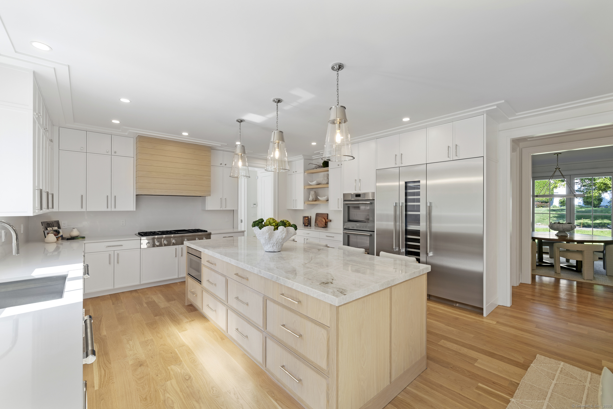 32 Webb Road Westport, CT 06880 - Photo 3 of 40 a kitchen with stainless steel appliances granite countertop a sink stove and refrigerator