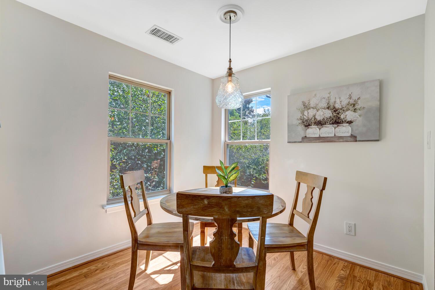 1791 Jonathan Way, Unit 1791C Reston, VA 20190 - Photo 11 of 58 a view of a dining room with furniture window and wooden floor