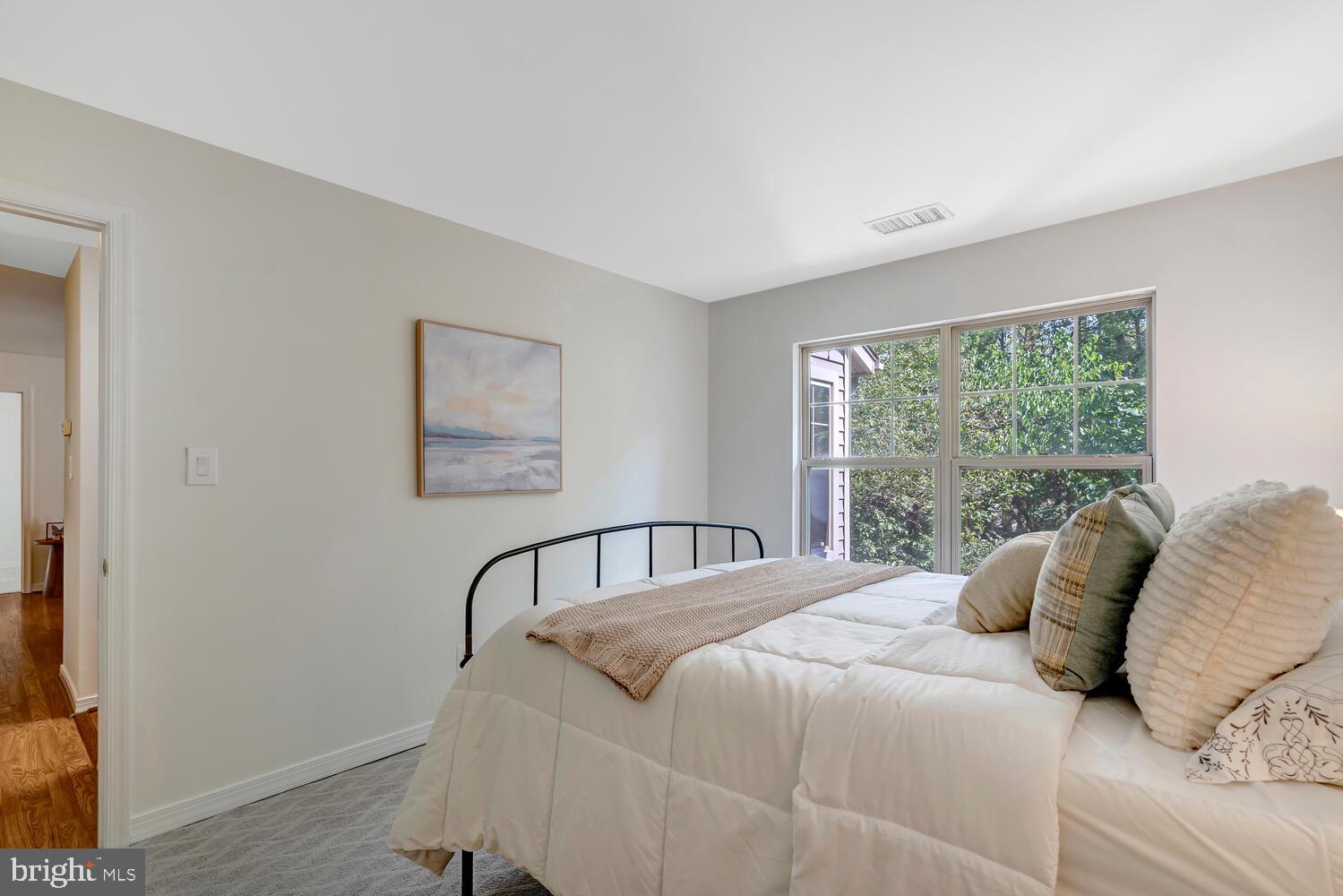 1791 Jonathan Way, Unit 1791C Reston, VA 20190 - Photo 17 of 58 a bedroom with a large bed and a window