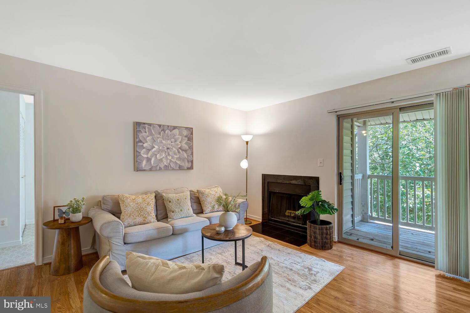 1791 Jonathan Way, Unit 1791C Reston, VA 20190 - Photo 19 of 58 a living room with furniture and a flat screen tv