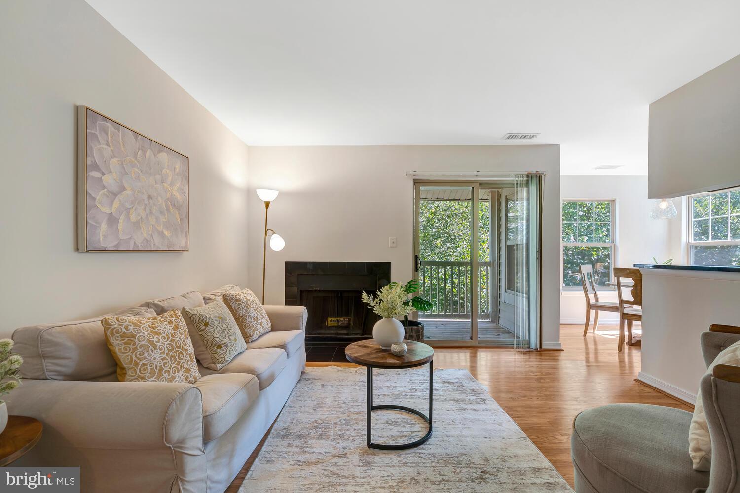 1791 Jonathan Way, Unit 1791C Reston, VA 20190 - Photo 22 of 58 a living room with furniture and a wooden floor