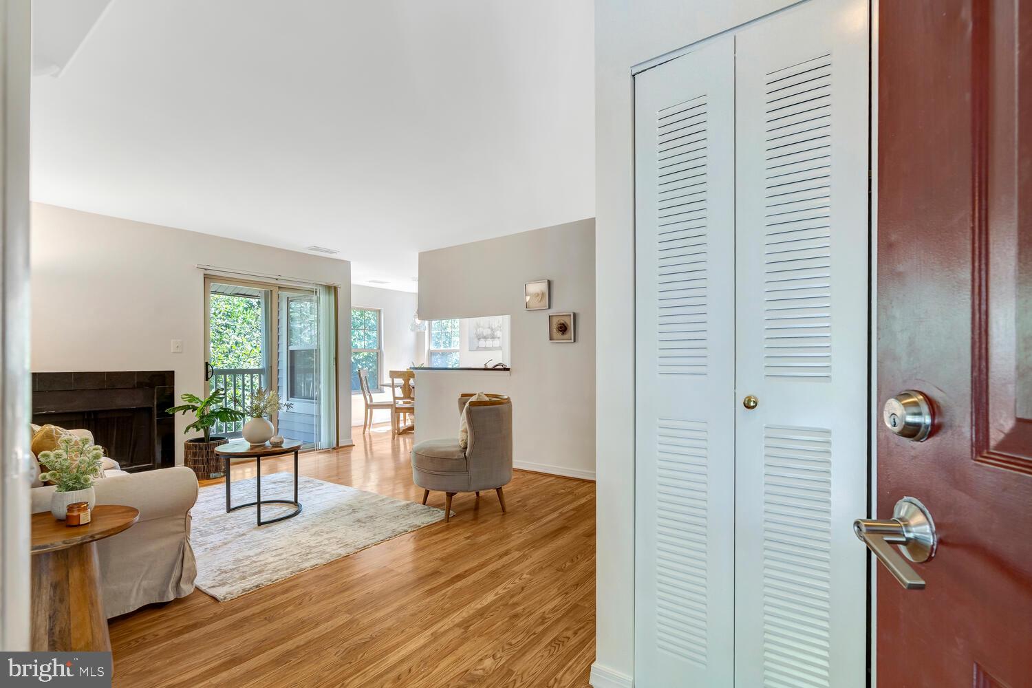 1791 Jonathan Way, Unit 1791C Reston, VA 20190 - Photo 23 of 58 a living room with furniture and a fireplace