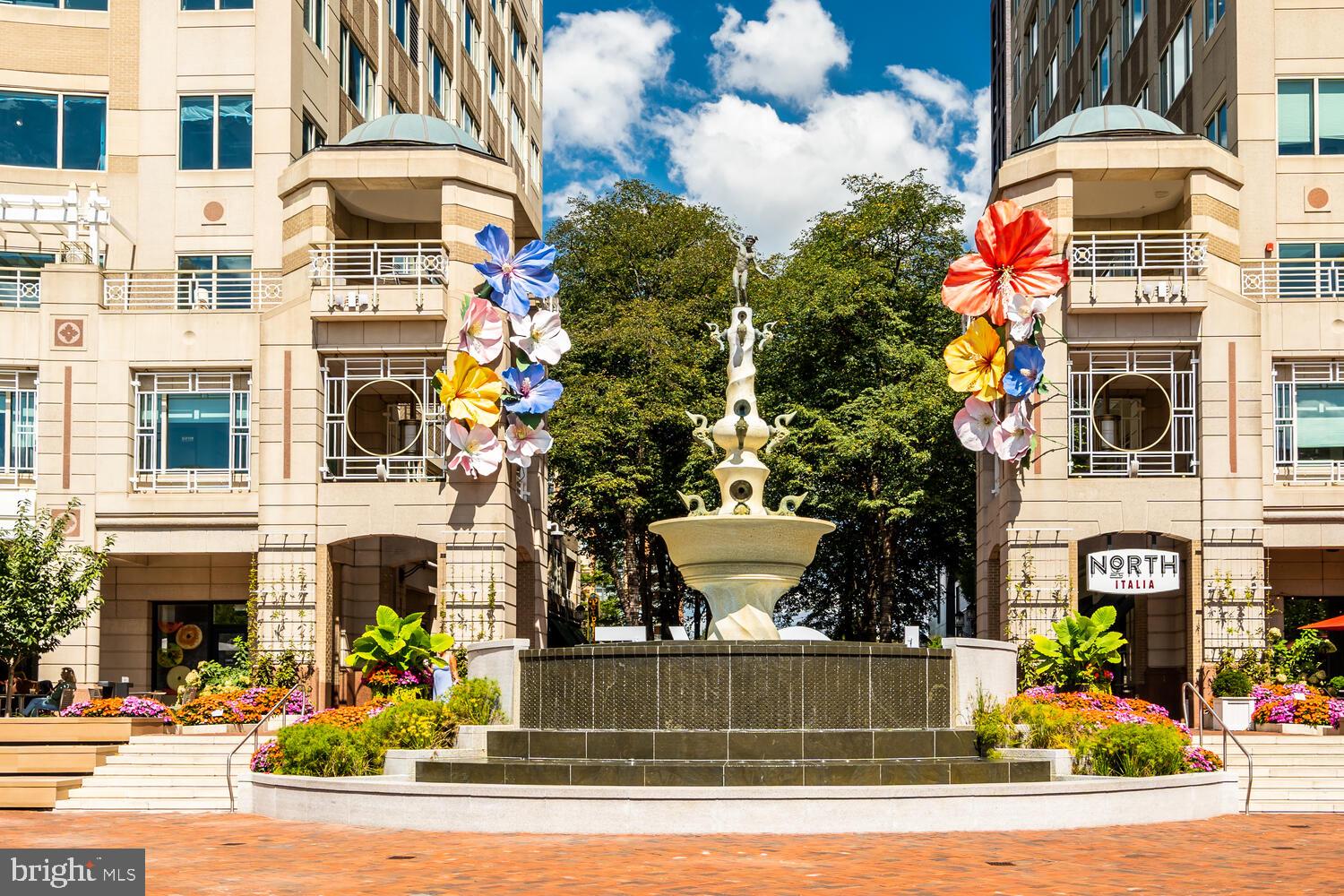 1791 Jonathan Way, Unit 1791C Reston, VA 20190 - Photo 32 of 58 a front view of multi story residential apartment building with a yard