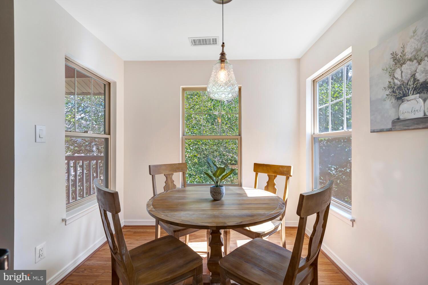1791 Jonathan Way, Unit 1791C Reston, VA 20190 - Photo 4 of 58 a view of a dining room with furniture window and outside view