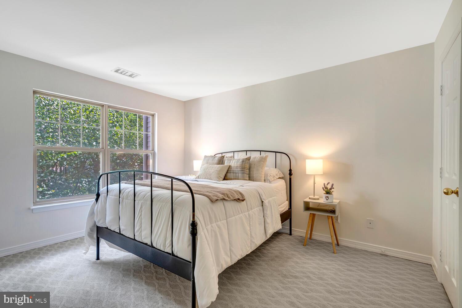1791 Jonathan Way, Unit 1791C Reston, VA 20190 - Photo 5 of 58 a bed sitting in a spacious bedroom next to a window