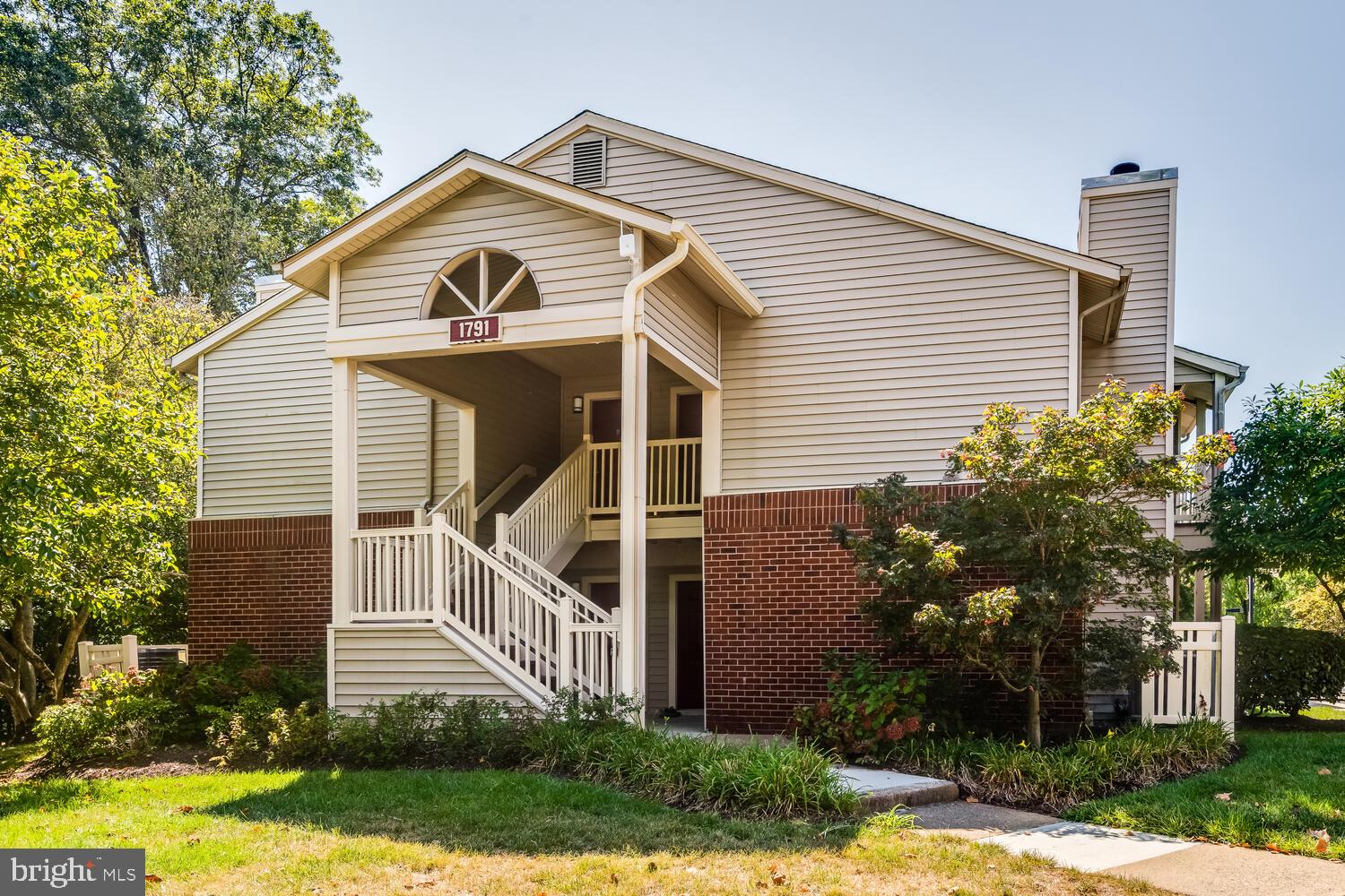 1791 Jonathan Way, Unit 1791C Reston, VA 20190 - Photo 53 of 58 a front view of a house with garden