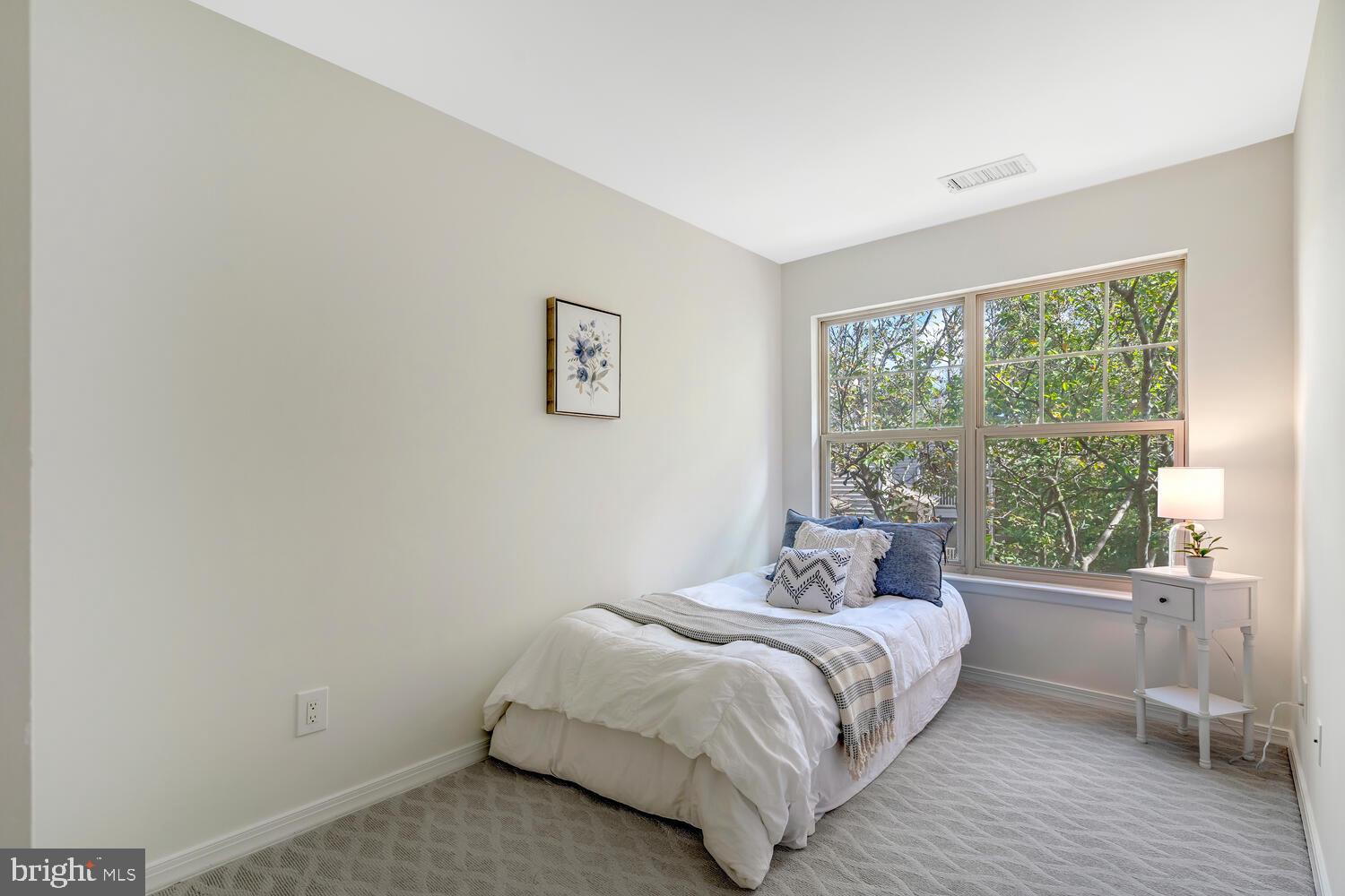 1791 Jonathan Way, Unit 1791C Reston, VA 20190 - Photo 9 of 58 a bedroom with a bed and a window