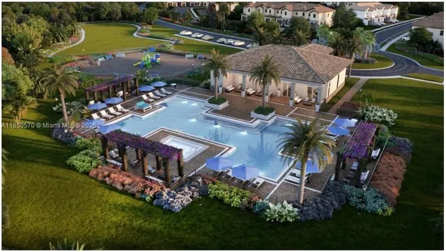 an aerial view of a house with garden space and lake view