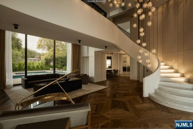 38 Cambridge Way Alpine, NJ 07620 - Photo 3 of 9 a room with gym equipment and large windows