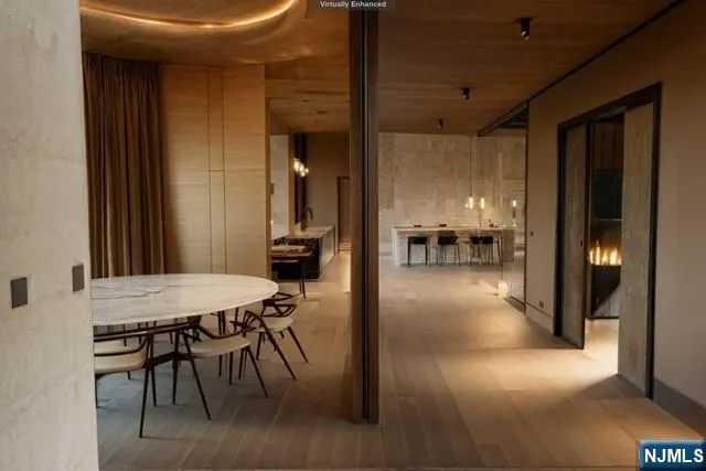 a dining room with furniture and a chandelier