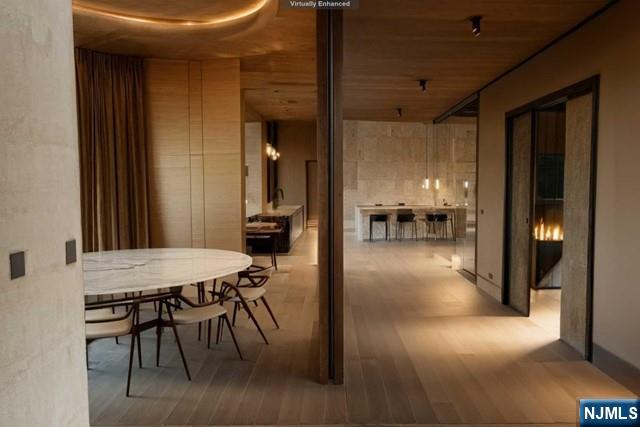 38 Cambridge Way Alpine, NJ 07620 - Photo 5 of 9 a dining room with furniture and a chandelier