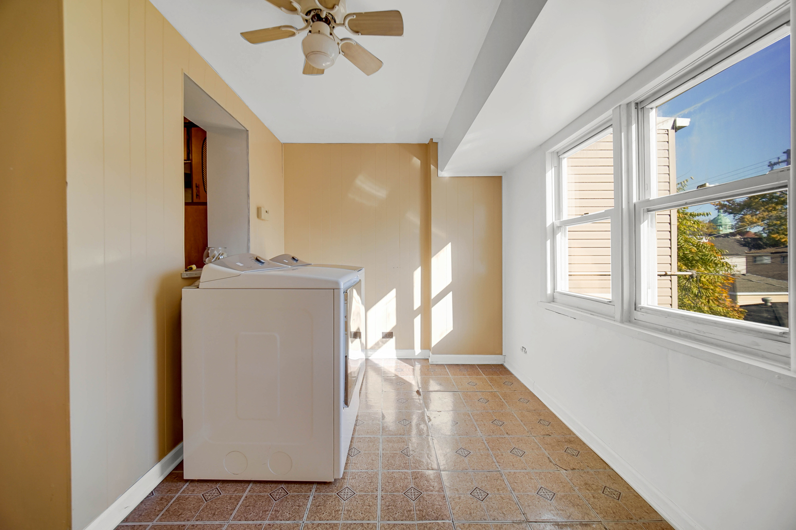 3329 South Racine Avenue Chicago, IL 60608 - Photo 14 of 33 a view of a room with a window and hardwood floor