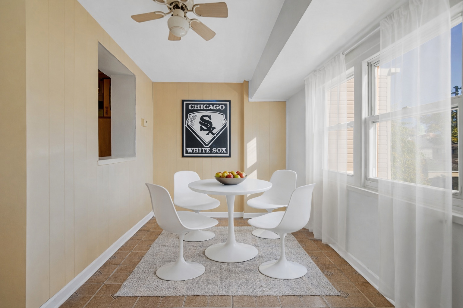 3329 South Racine Avenue Chicago, IL 60608 - Photo 15 of 33 a dining room with wooden floor and a chandelier