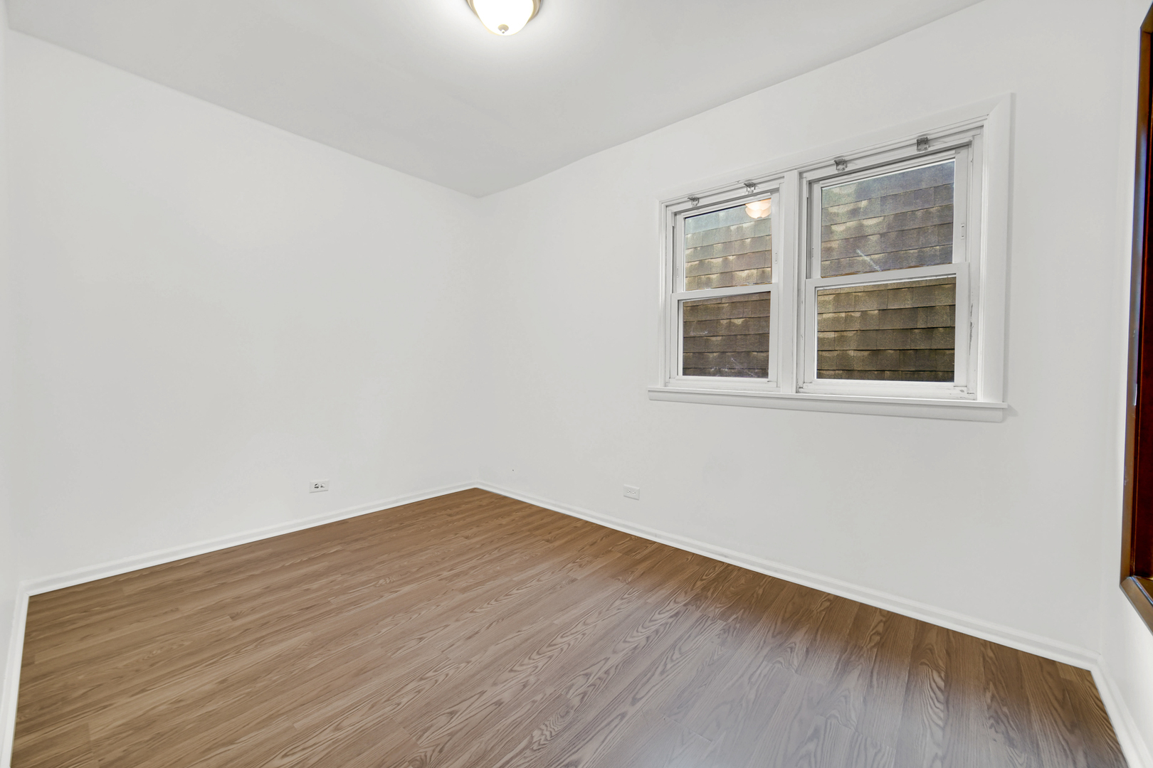 3329 South Racine Avenue Chicago, IL 60608 - Photo 17 of 33 an empty room with a window