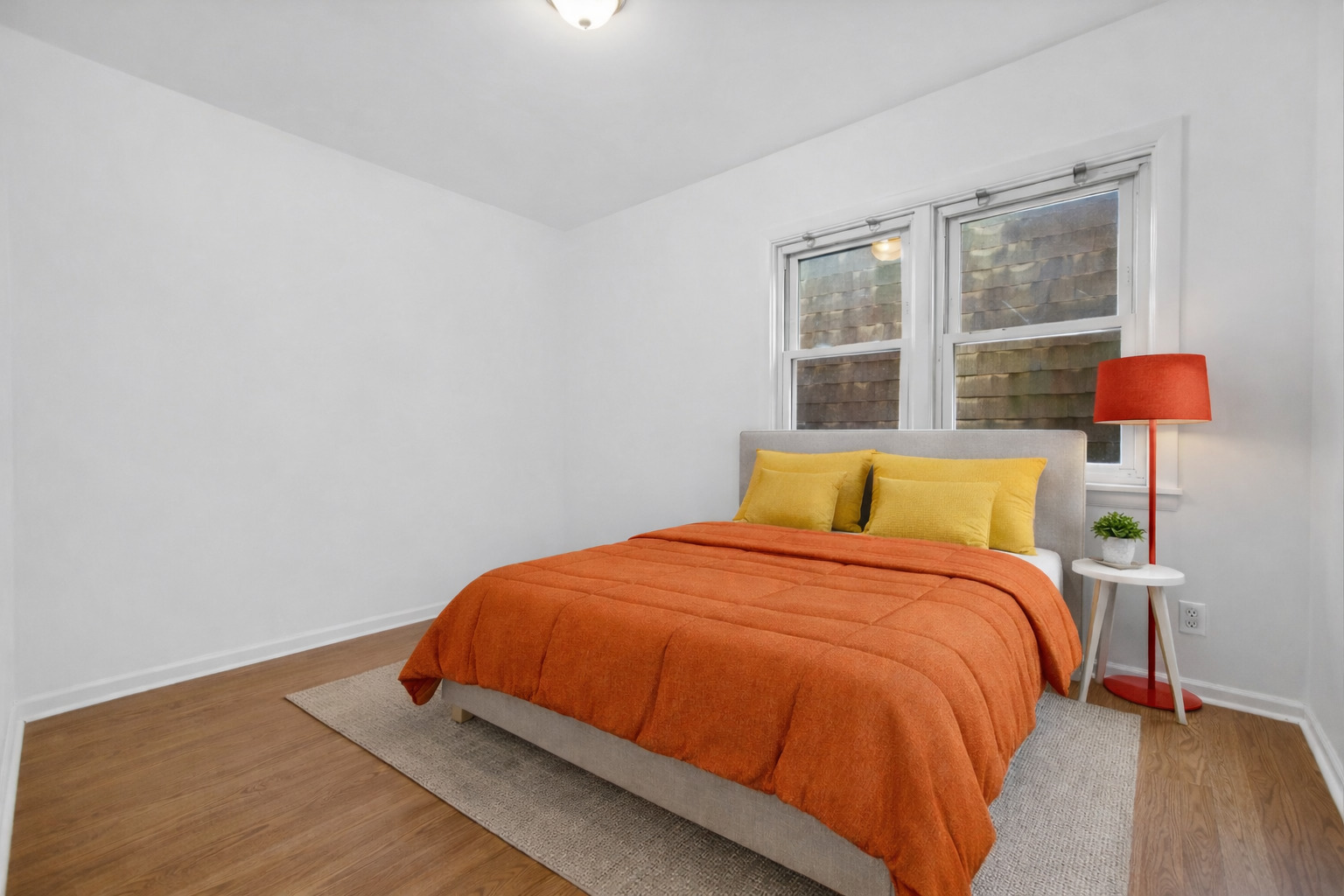 3329 South Racine Avenue Chicago, IL 60608 - Photo 18 of 33 a bedroom with a bed and window