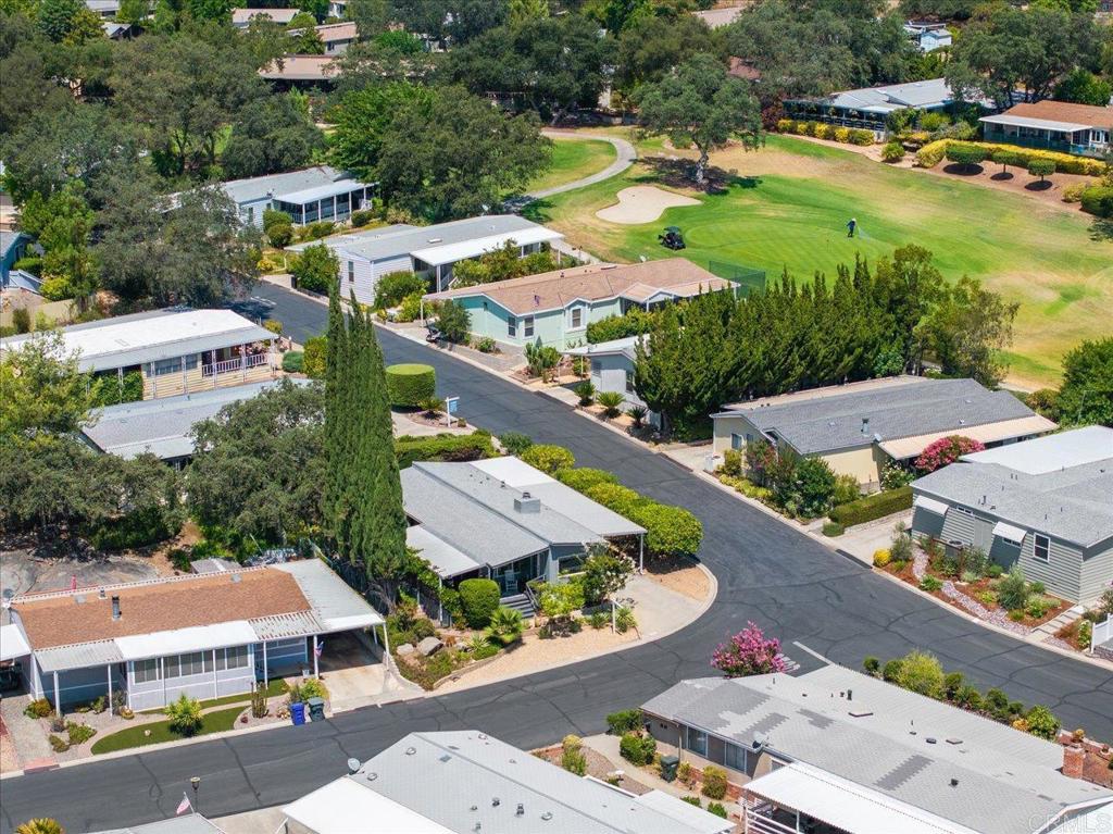 18218 Paradise Mountain Road, Unit 116 Valley Center, CA 92082 - Photo 35 of 35 an aerial view of residential houses and lake view