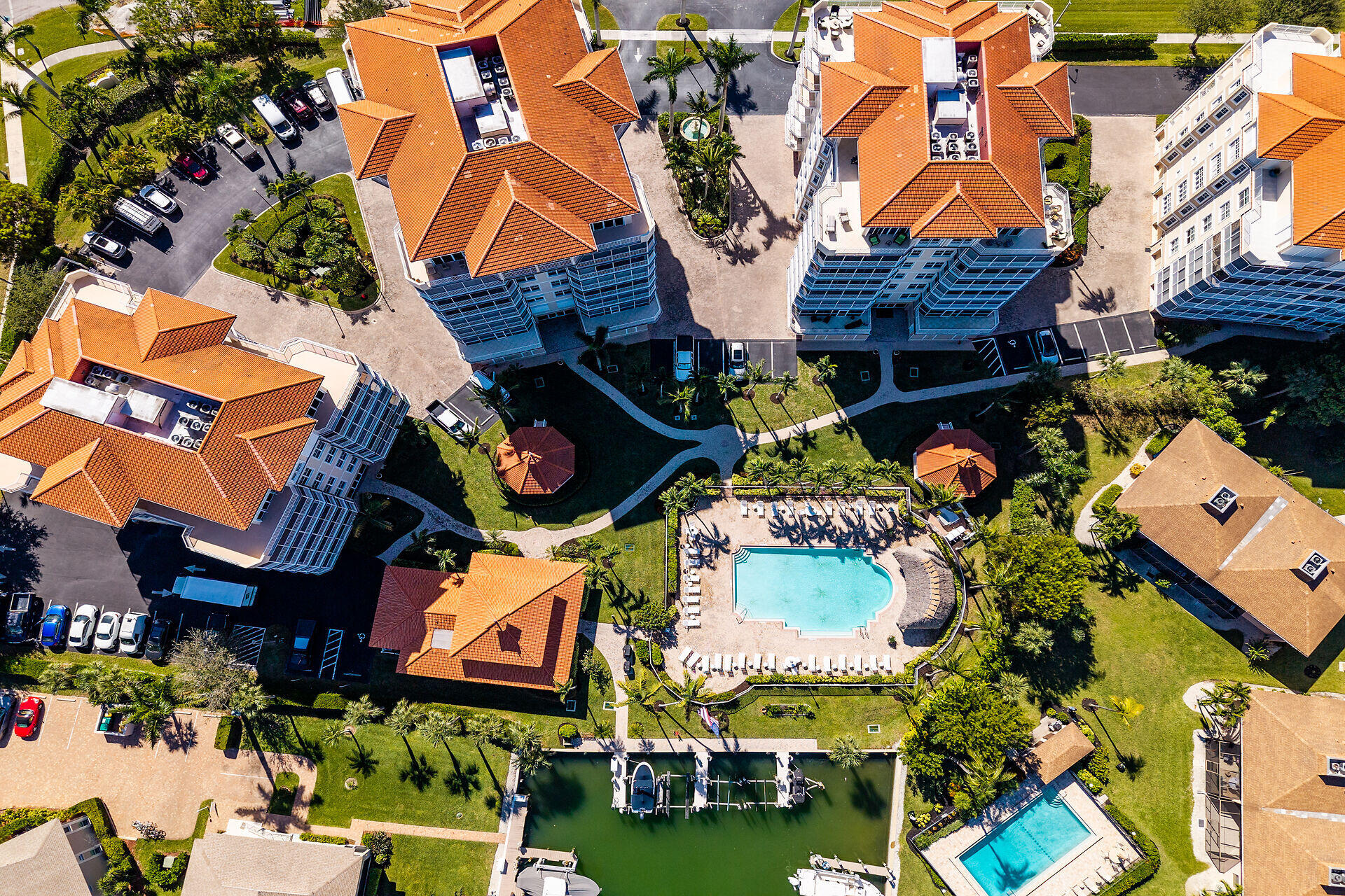 1111 Swallow Avenue, Unit 1401 Marco Island, FL 34145 - Photo 3 of 36 an aerial view of multiple houses with yard