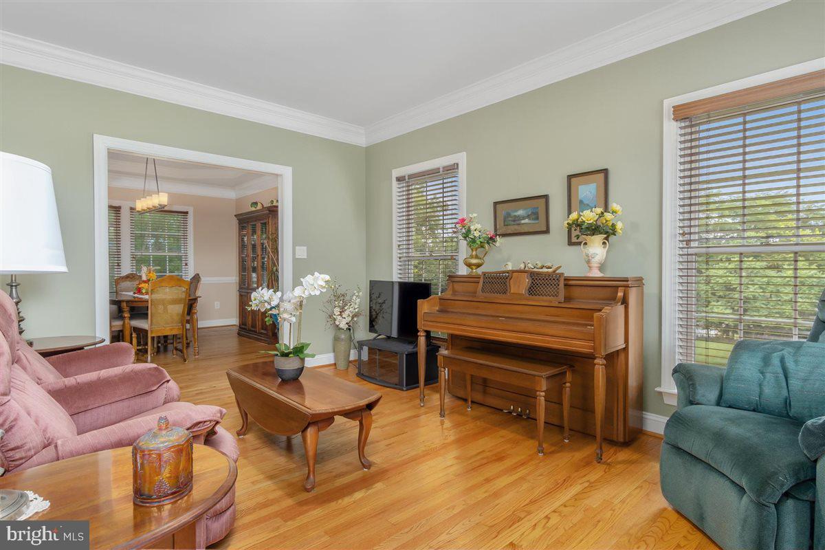 20239 Locust Grove Road Rohrersville, MD 21779 - Photo 12 of 51 a living room with furniture and a piano