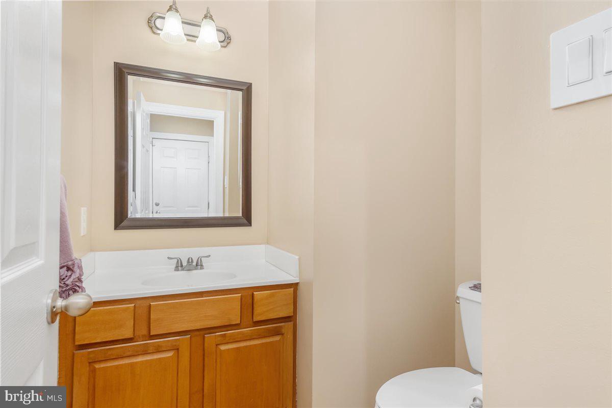 20239 Locust Grove Road Rohrersville, MD 21779 - Photo 23 of 51 a bathroom with a toilet sink and mirror