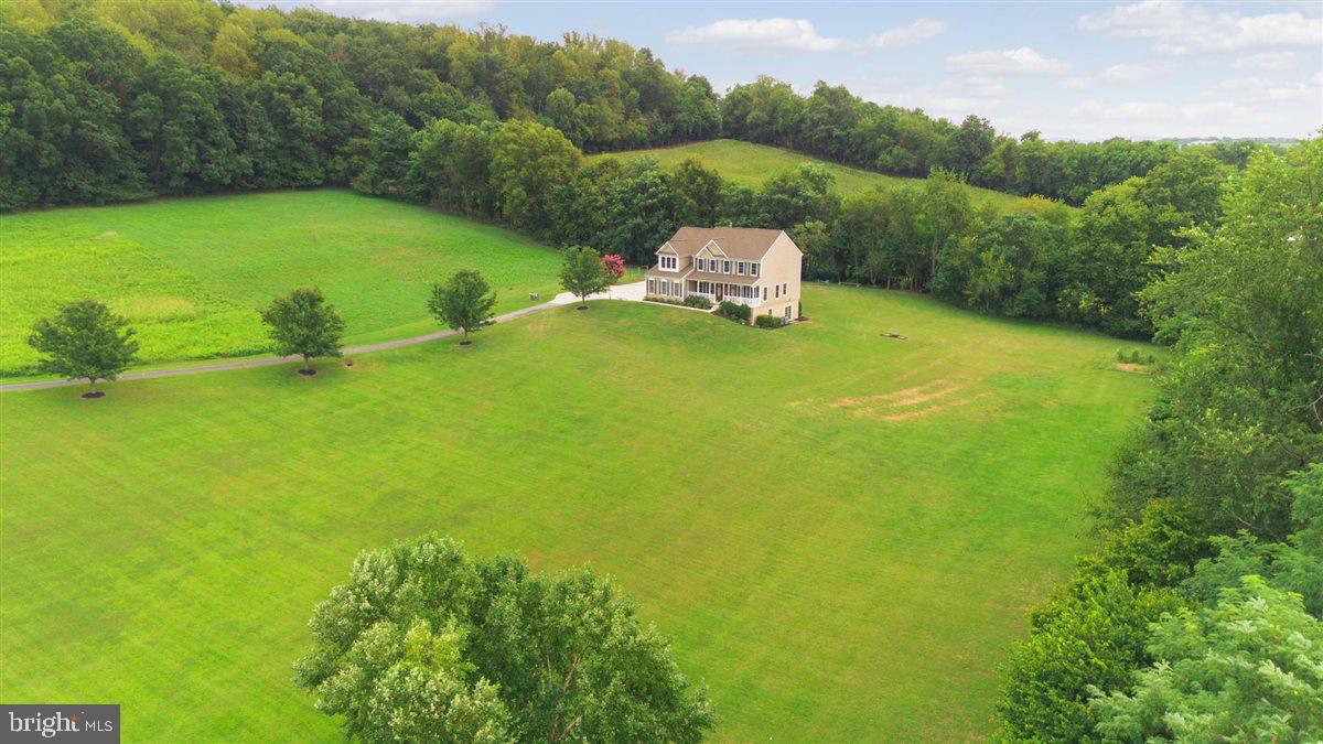 20239 Locust Grove Road Rohrersville, MD 21779 - Photo 3 of 51 a view of a lake with a yard