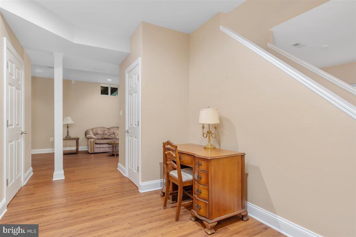 20239 Locust Grove Road Rohrersville, MD 21779 - Photo 36 of 51 a view of a room with wooden floor and furniture