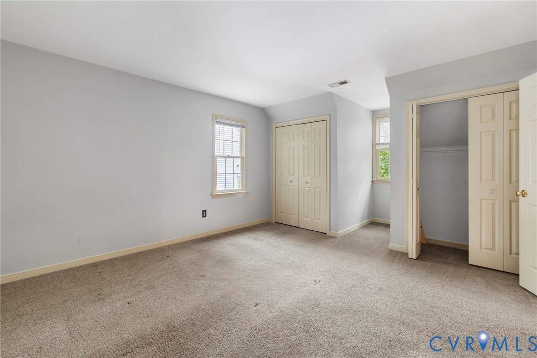 10933 Point Grey Road Henrico, VA 23233 - Photo 12 of 15 Unfurnished bedroom with two closets and light car