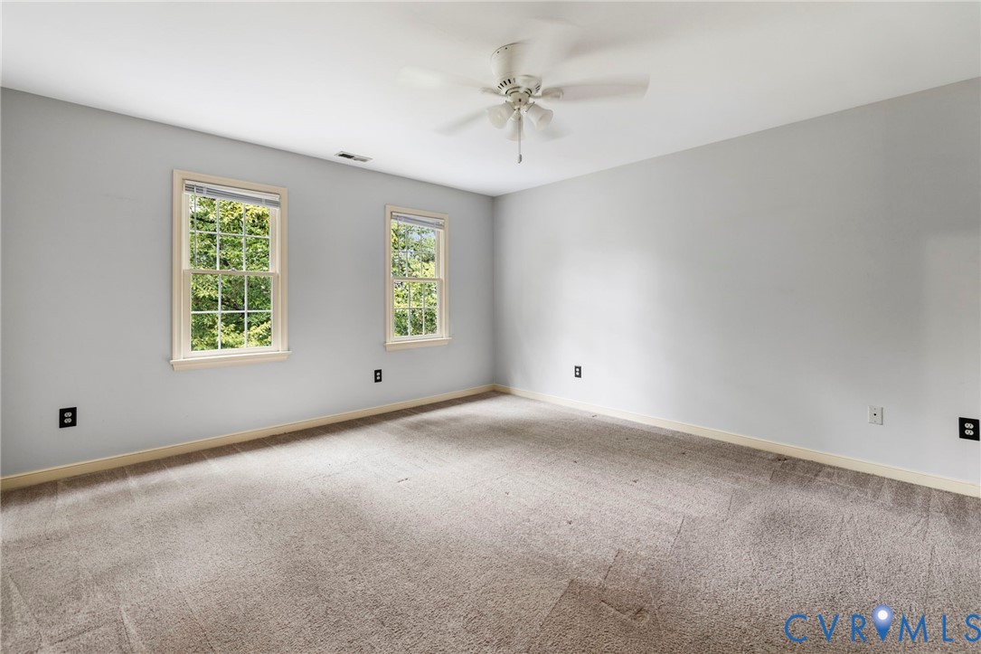 10933 Point Grey Road Henrico, VA 23233 - Photo 13 of 15 Carpeted spare room with ceiling fan and baseboard
