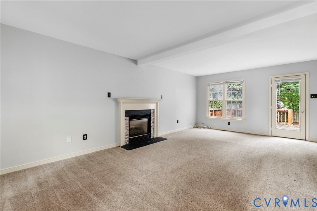 10933 Point Grey Road Henrico, VA 23233 - Photo 4 of 15 Unfurnished living room with carpet floors, beam c