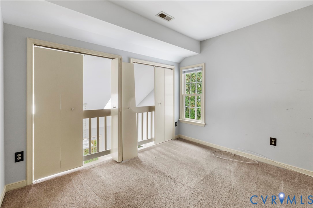 10933 Point Grey Road Henrico, VA 23233 - Photo 8 of 15 room featuring light carpet and vaulted ceiling