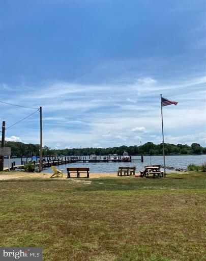 4938 Rullman Road Shady Side, MD 20764 - Photo 26 of 29 a view of a lake with houses in the background