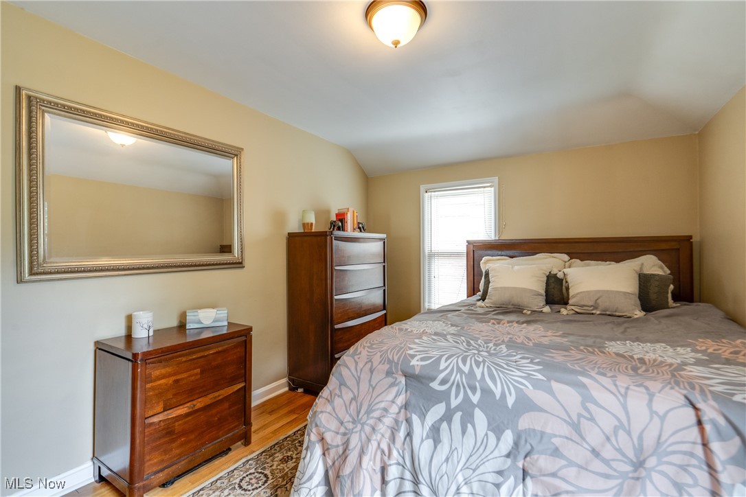 1375 Gordon Road Lyndhurst, OH 44124 - Photo 19 of 34 Bedroom featuring light wood-type flooring and lofted ceiling