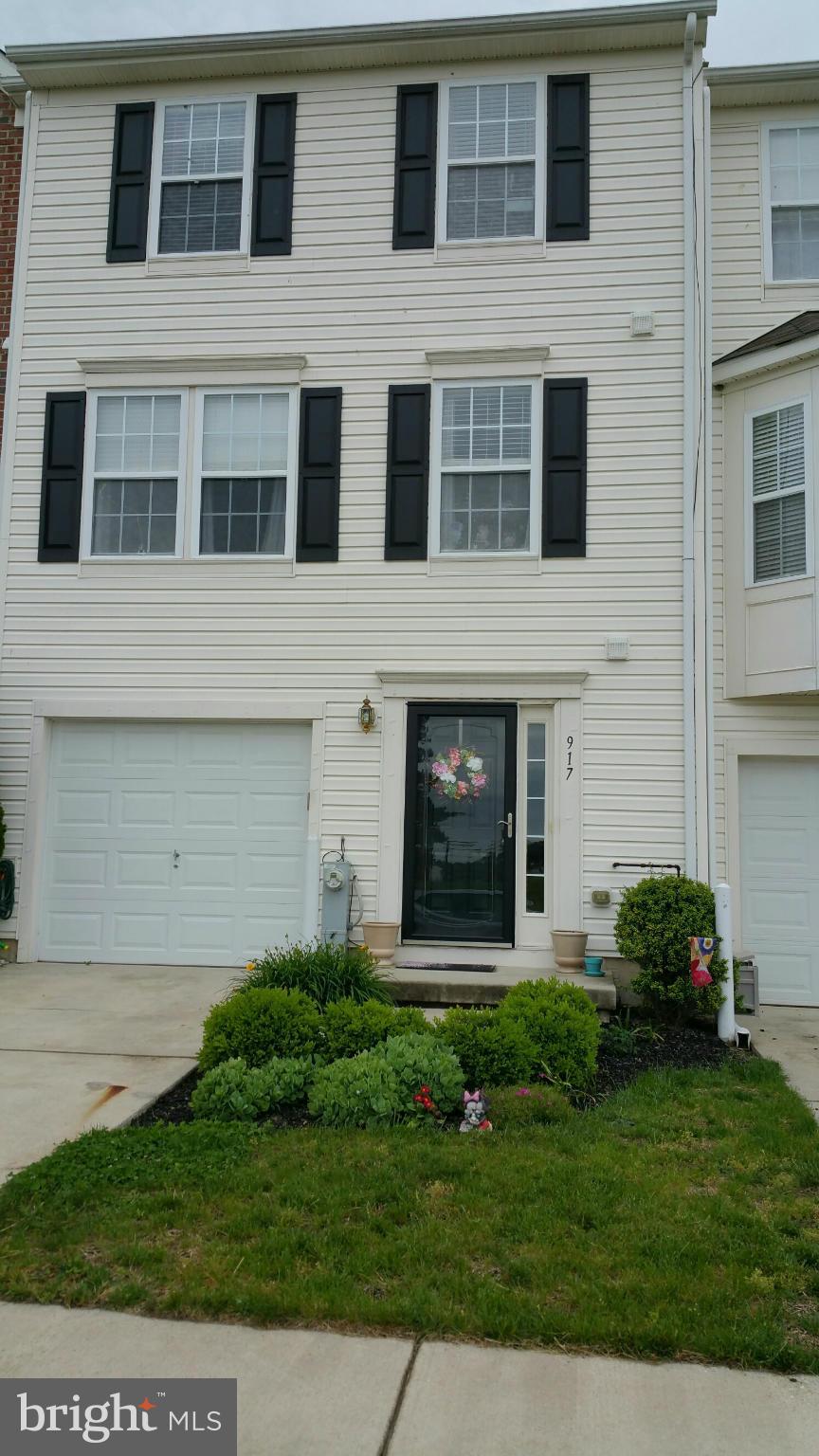 917 Tipton Road Baltimore, MD 21220 - Photo 1 of 24 a view of a house with a yard and many windows