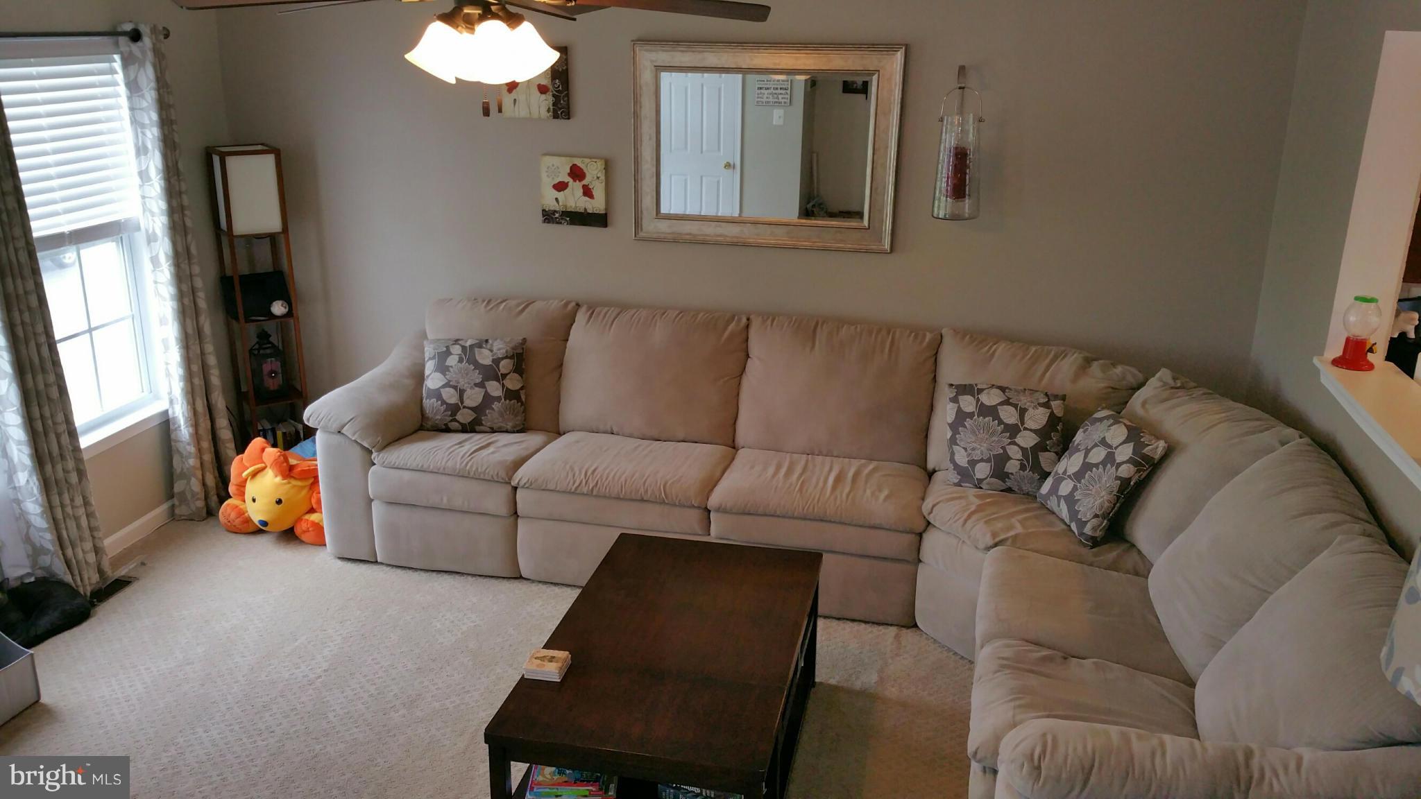 917 Tipton Road Baltimore, MD 21220 - Photo 5 of 24 a living room with furniture and a mirror