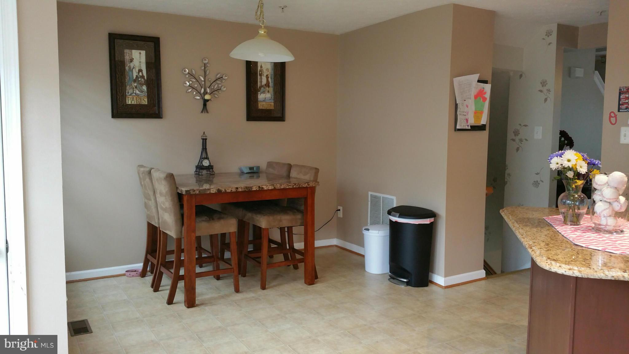 917 Tipton Road Baltimore, MD 21220 - Photo 7 of 24 a dining room with furniture and window