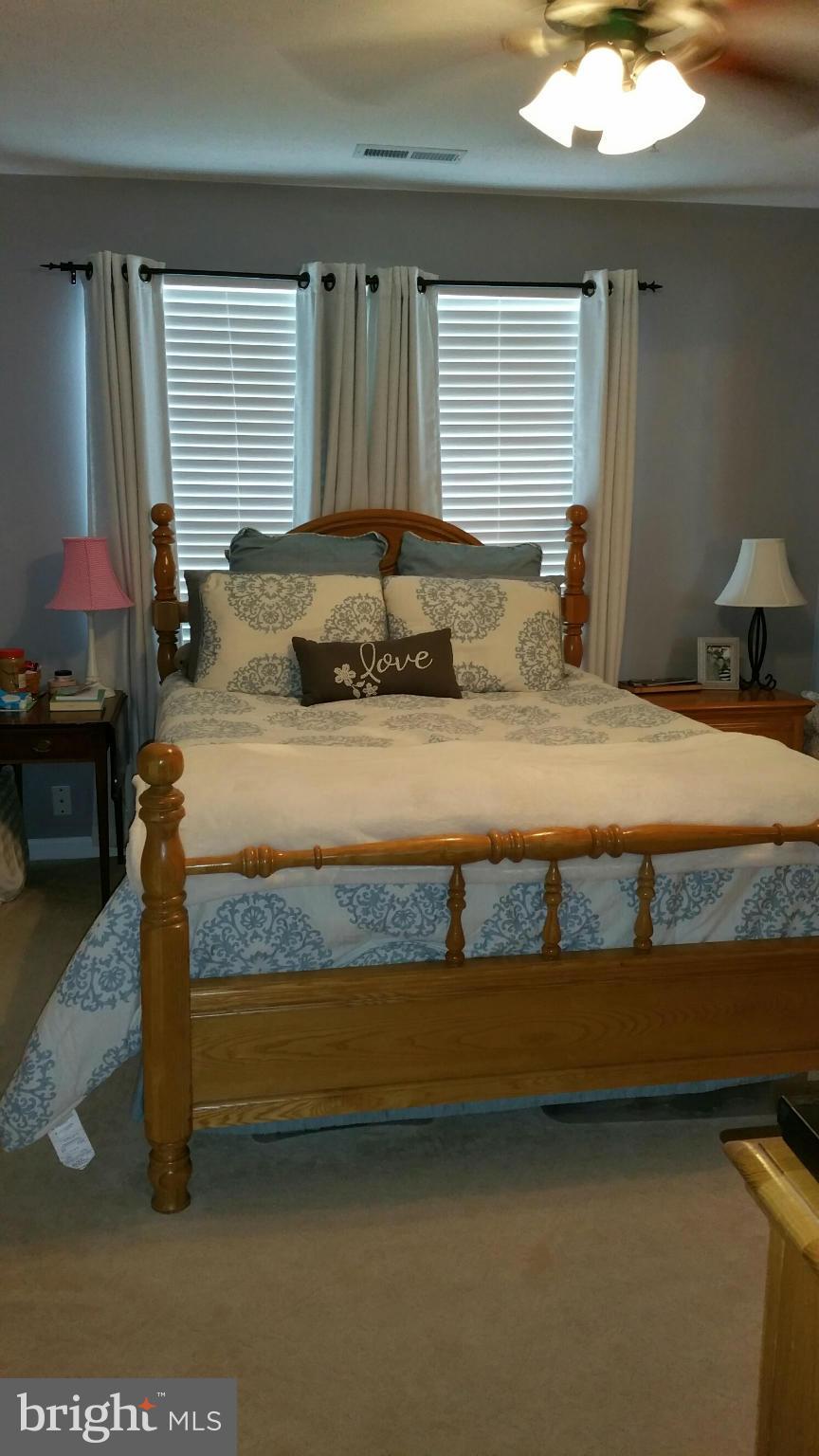 917 Tipton Road Baltimore, MD 21220 - Photo 10 of 24 a bedroom with a bed and window