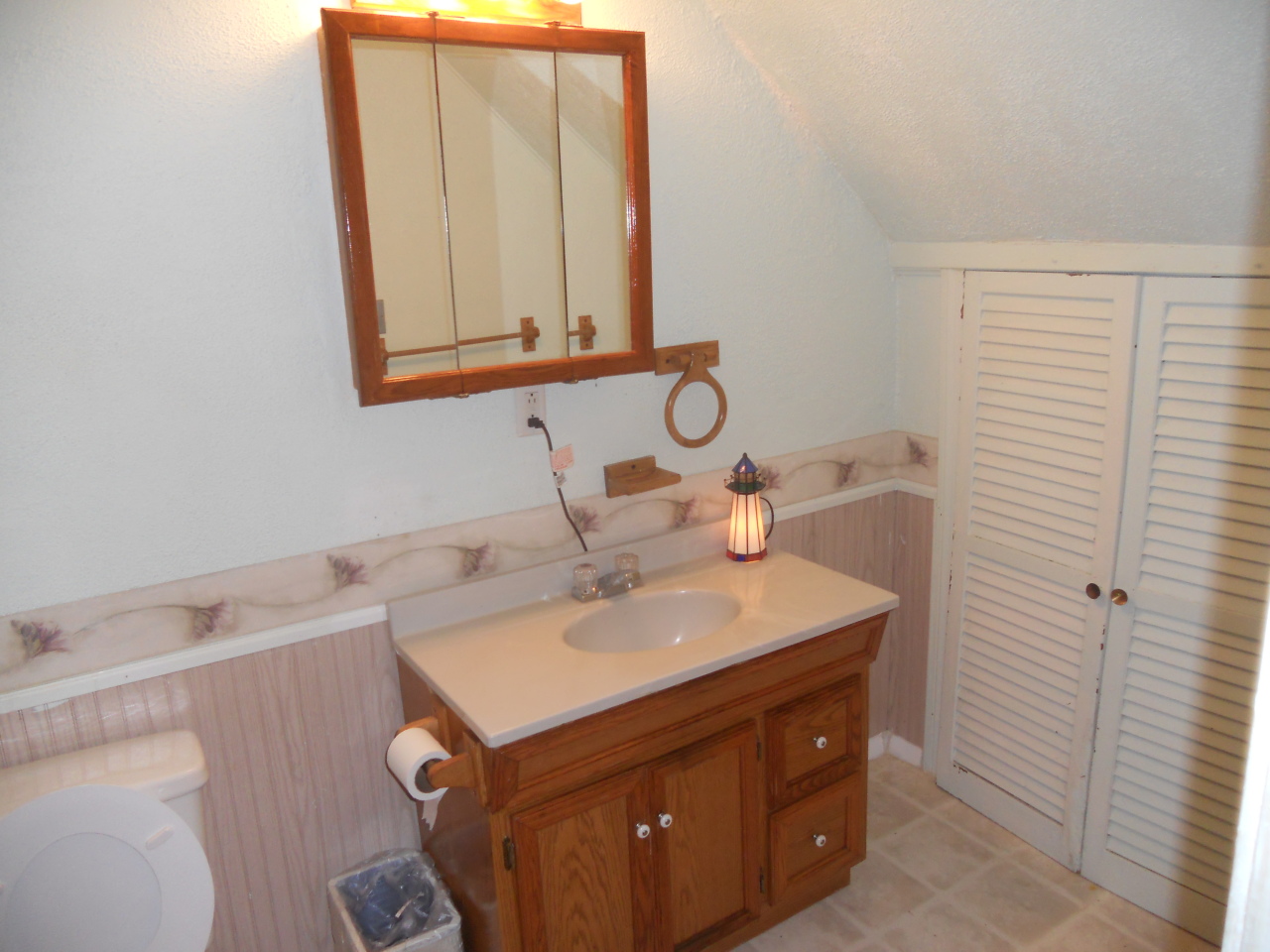 2045 Vermont Rte 100, Unit 100 Readsboro, VT 05350 - Photo 14 of 33 a bathroom with a sink vanity and a mirror
