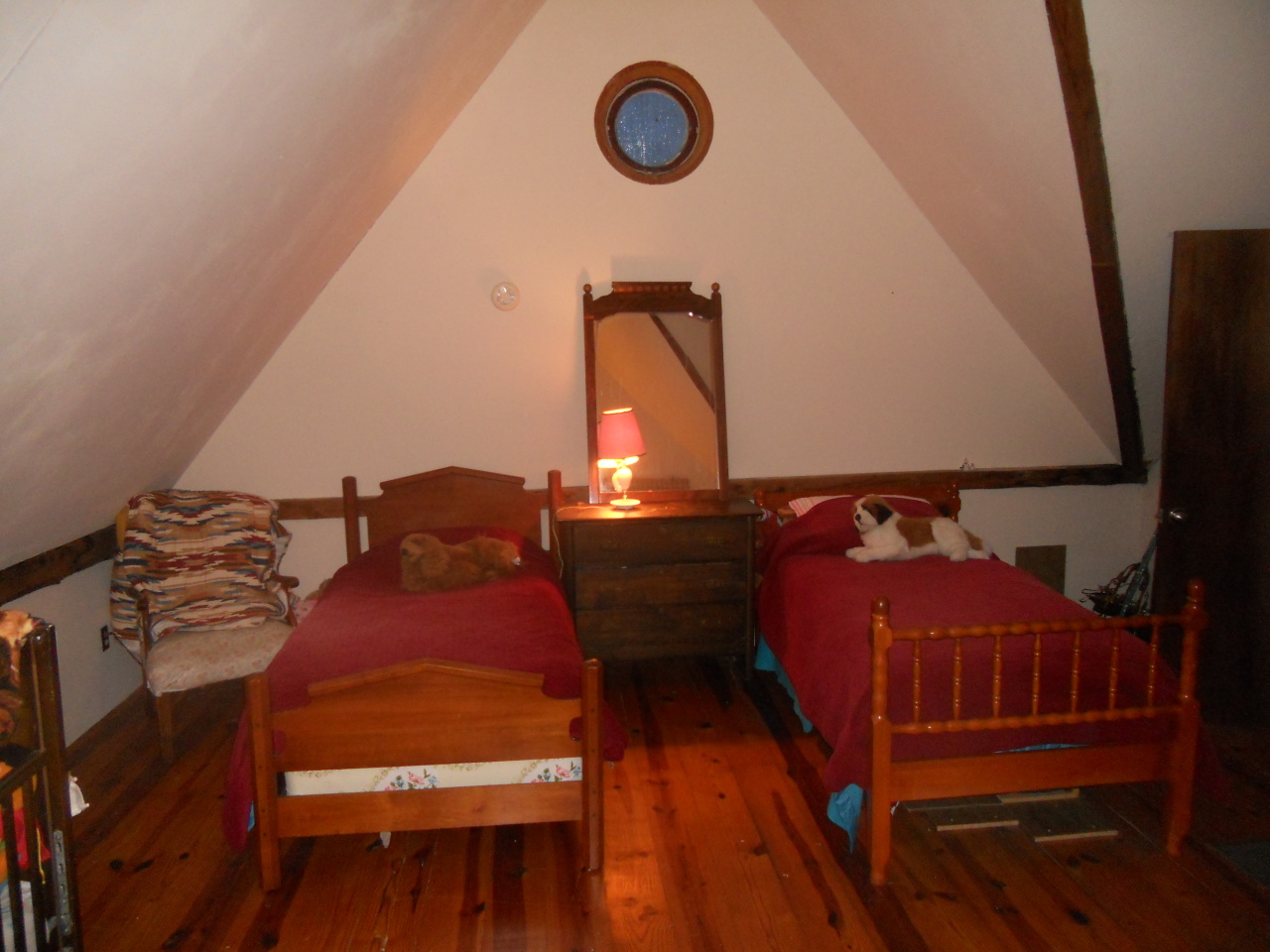 2045 Vermont Rte 100, Unit 100 Readsboro, VT 05350 - Photo 22 of 33 a bedroom with a bed and a mirror