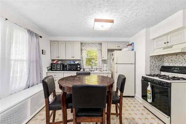 a bedroom with a bed and a television