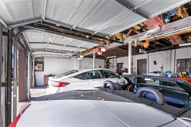 a view of parking garage with cars