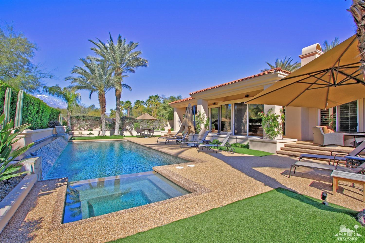 250 Loch Lomond Road Rancho Mirage, CA 92270 - Photo 1 of 33 a view of a patio with swimming pool table and chairs