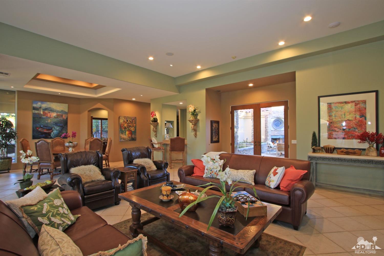 250 Loch Lomond Road Rancho Mirage, CA 92270 - Photo 11 of 33 a living room with furniture and a large window
