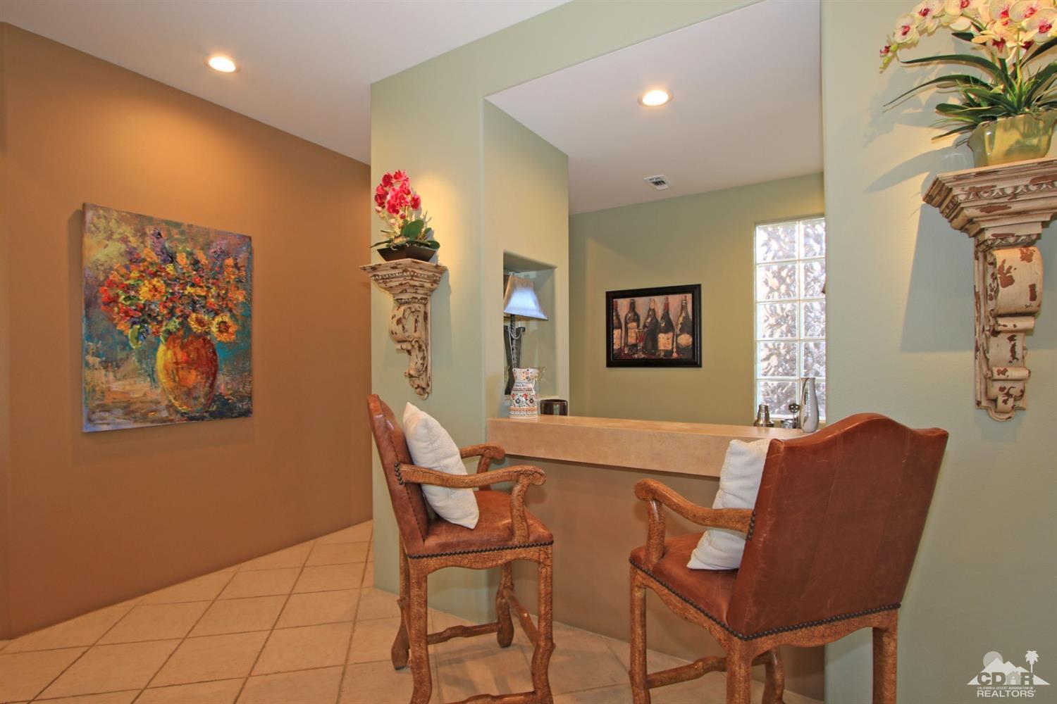 250 Loch Lomond Road Rancho Mirage, CA 92270 - Photo 13 of 33 a living room with furniture and a painting