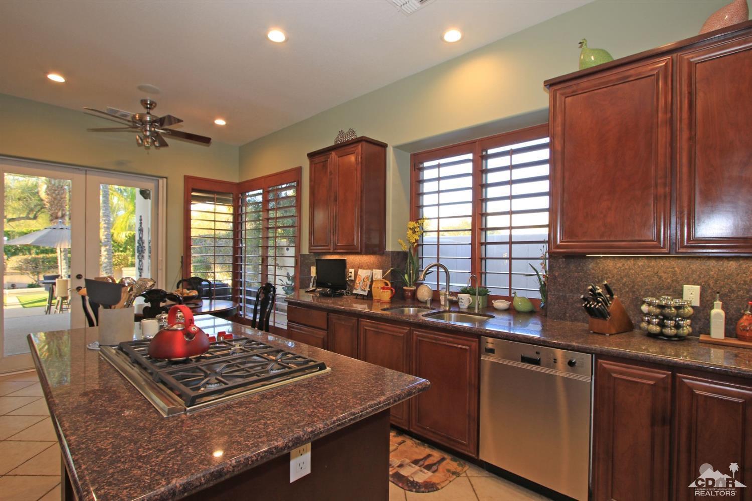 250 Loch Lomond Road Rancho Mirage, CA 92270 - Photo 15 of 33 a kitchen with sink stove and cabinets