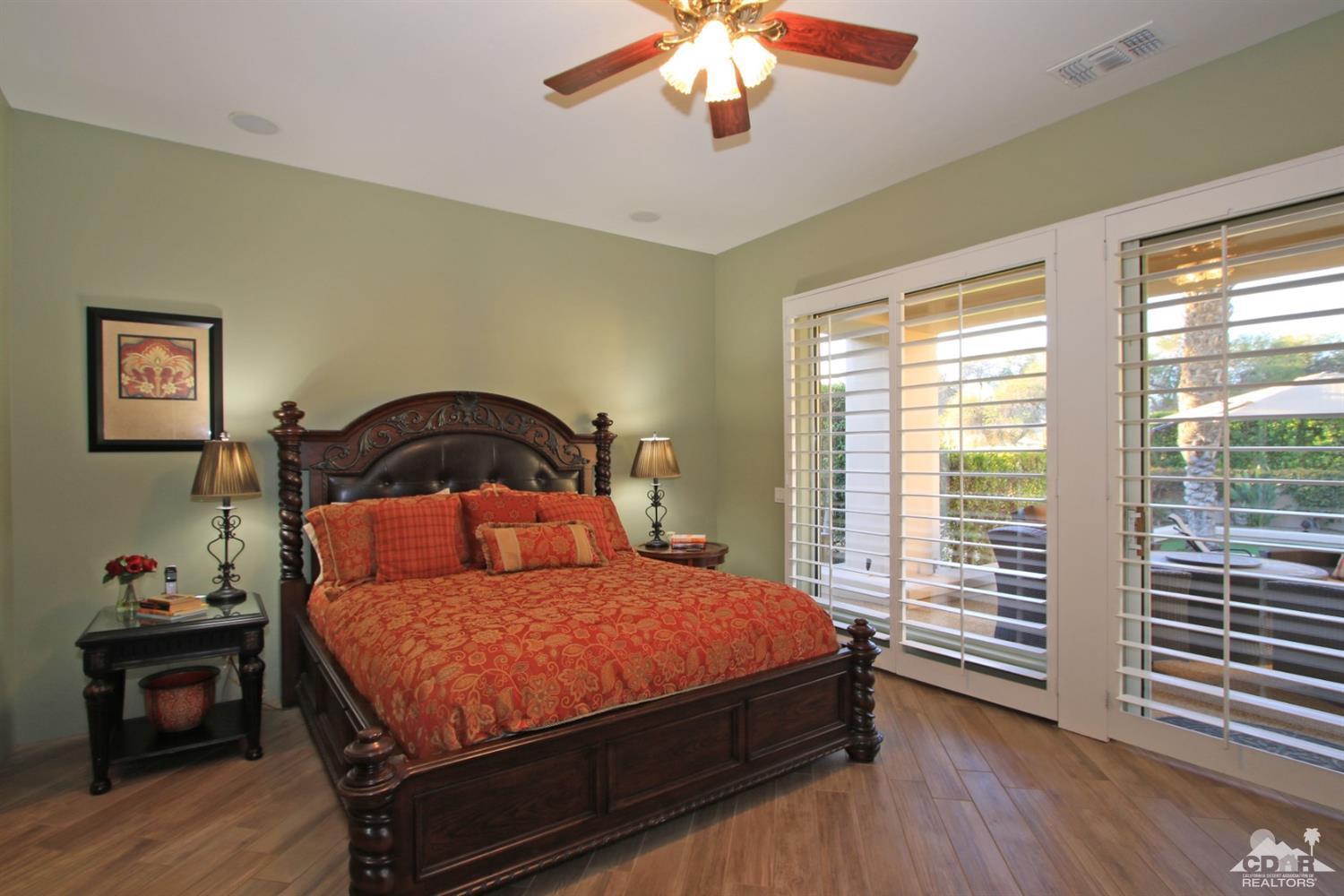 250 Loch Lomond Road Rancho Mirage, CA 92270 - Photo 19 of 33 a bedroom with a bed and a window