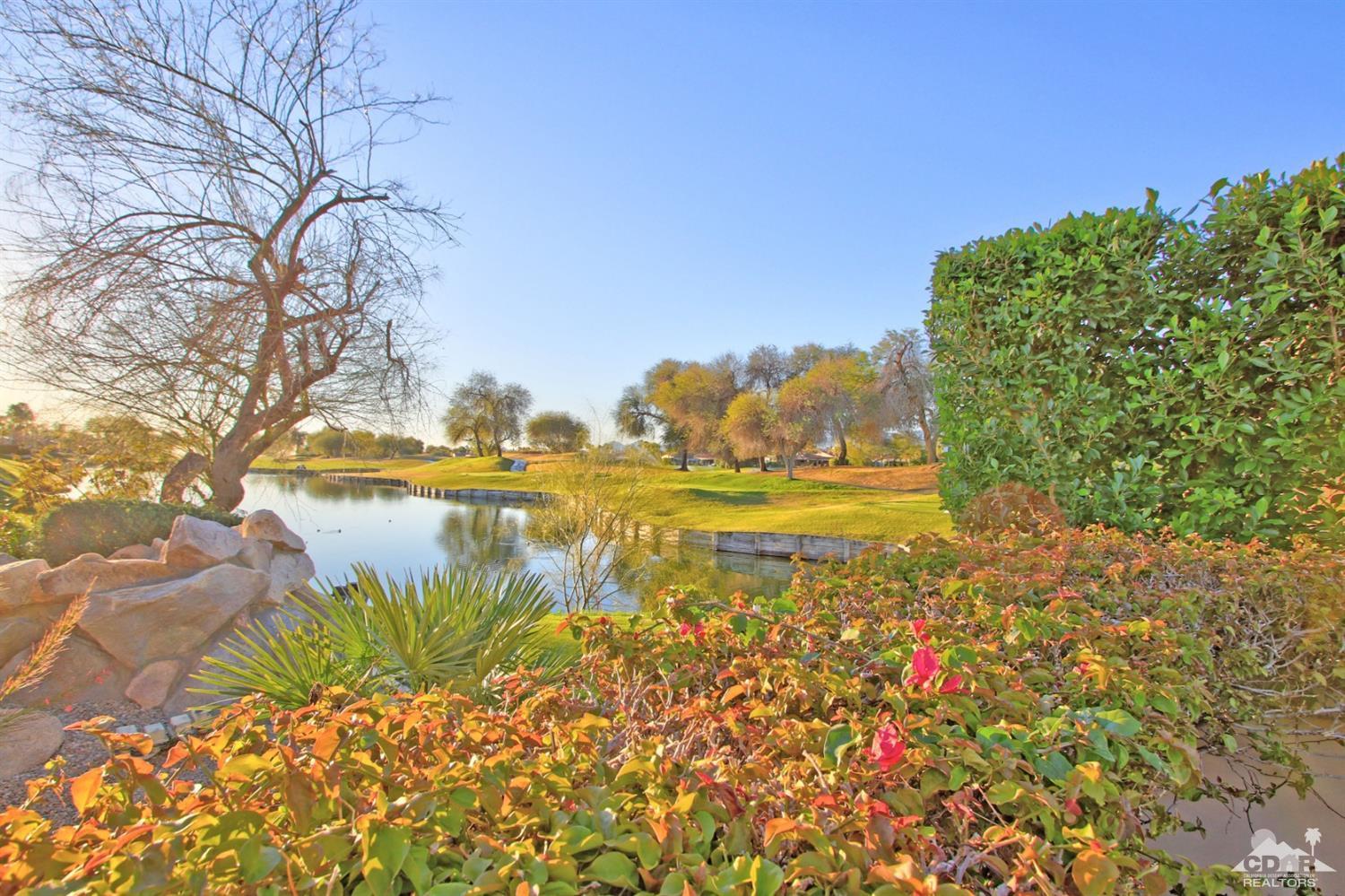 250 Loch Lomond Road Rancho Mirage, CA 92270 - Photo 3 of 33 a view of a lake with a big yard