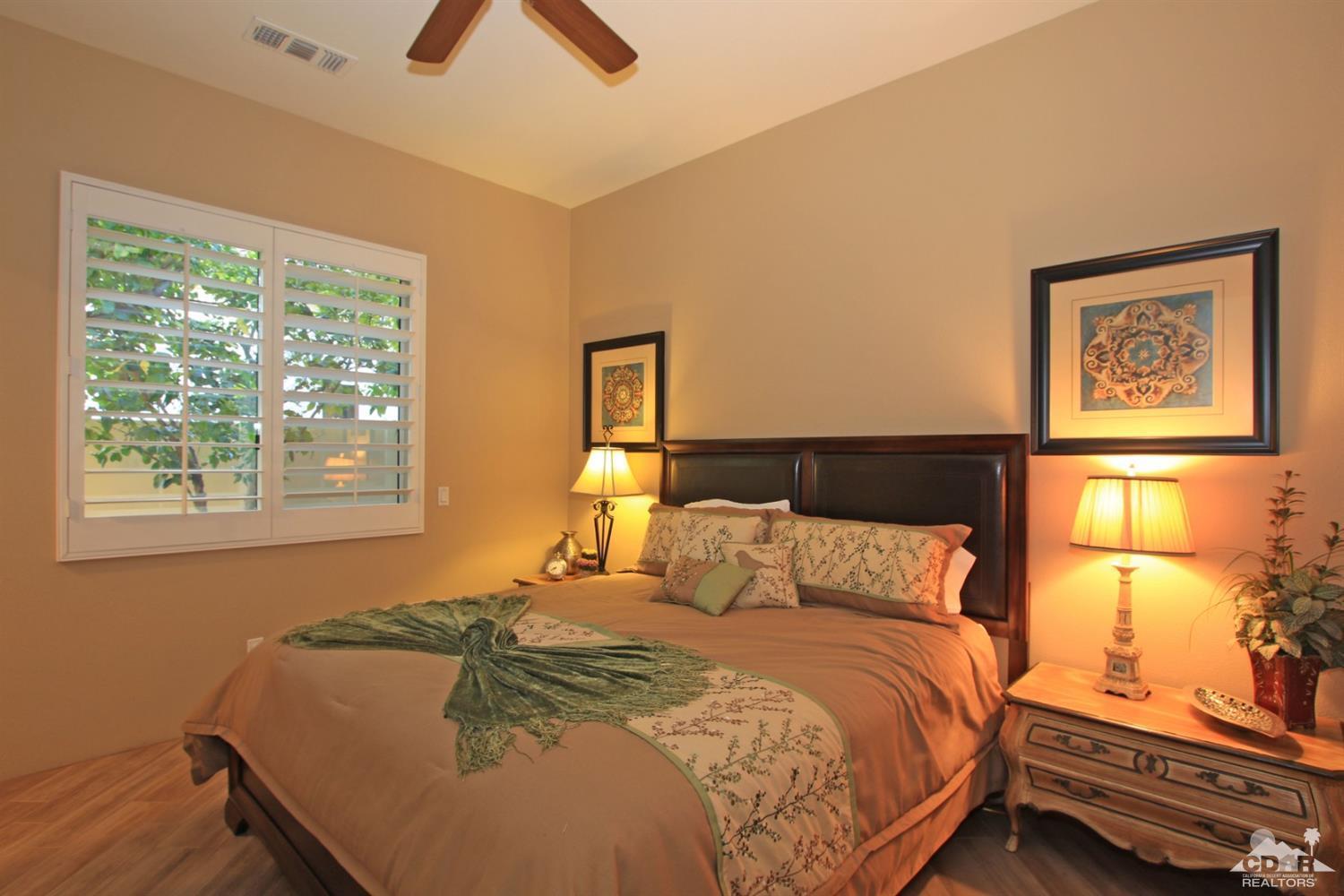 250 Loch Lomond Road Rancho Mirage, CA 92270 - Photo 25 of 33 a bedroom with a bed and wooden floor