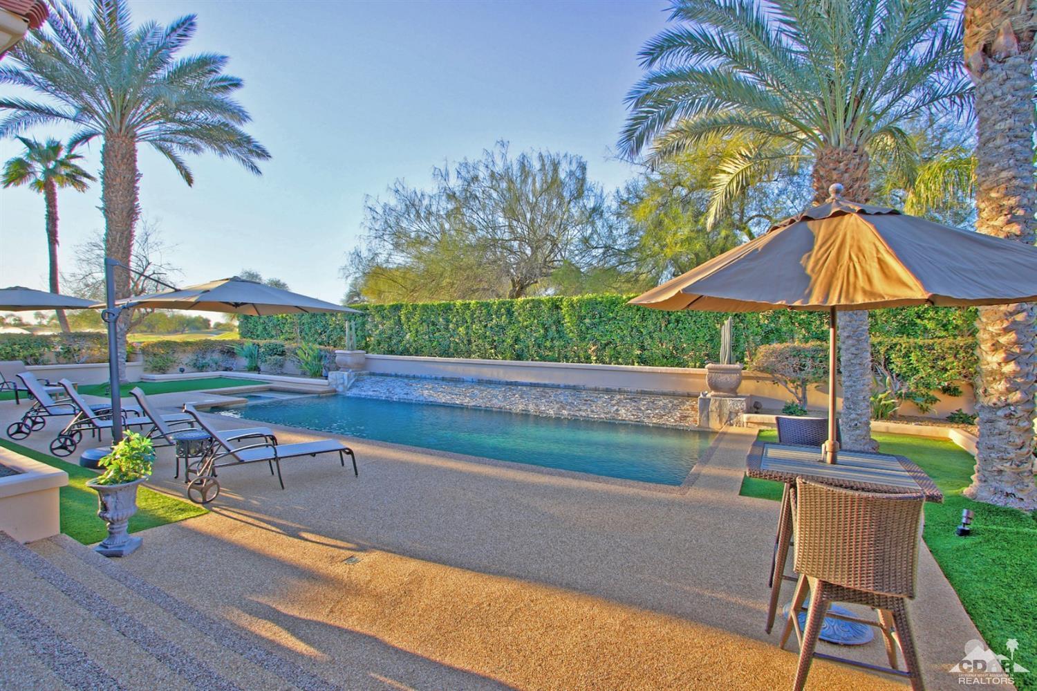 250 Loch Lomond Road Rancho Mirage, CA 92270 - Photo 30 of 33 a view of a swimming pool with a patio and a seating space