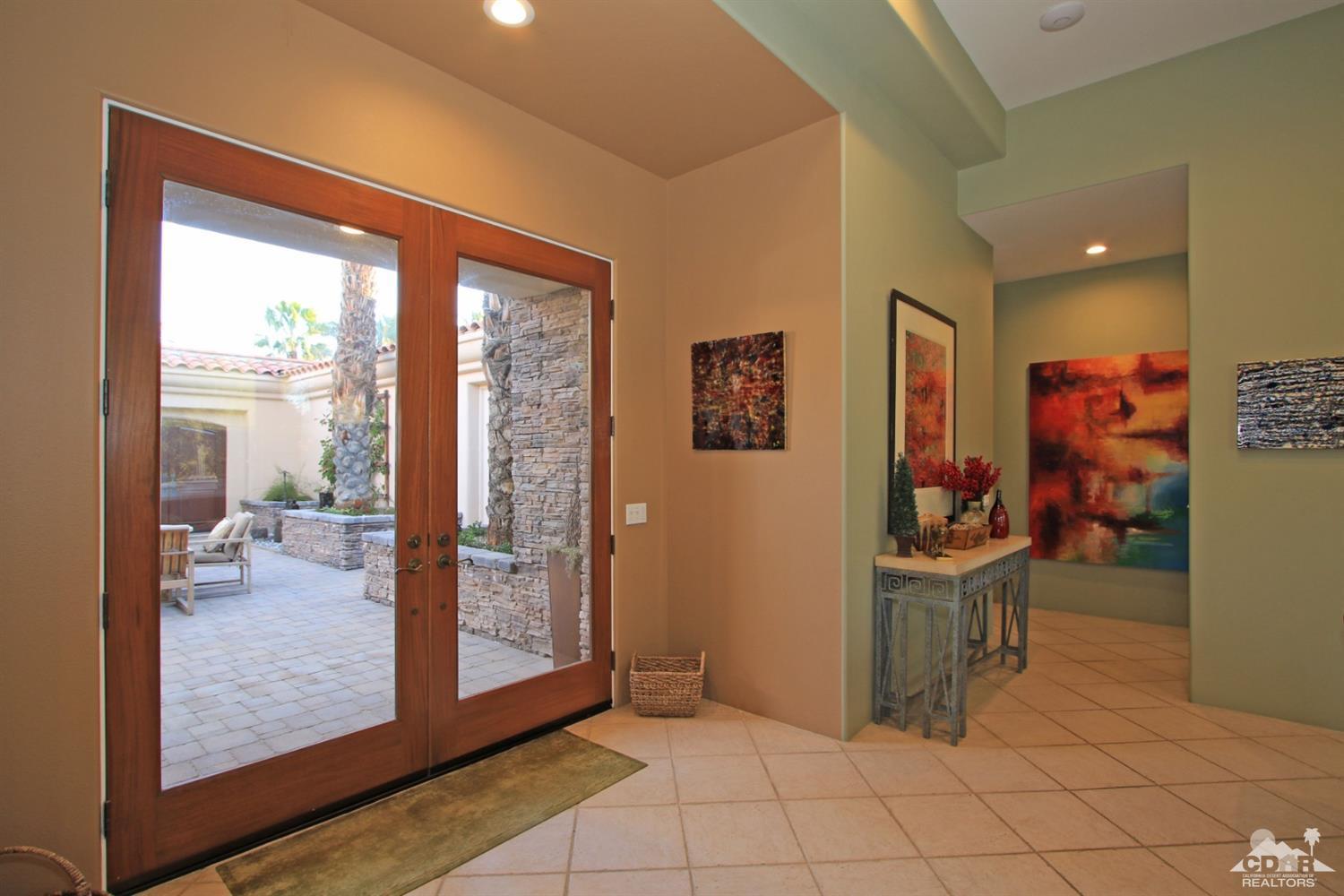 250 Loch Lomond Road Rancho Mirage, CA 92270 - Photo 8 of 33 a view of a hardwood floor and dining room in a room