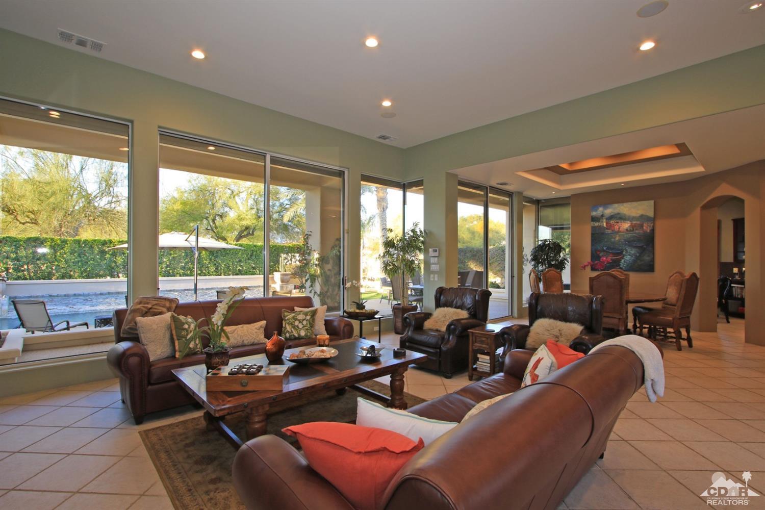 250 Loch Lomond Road Rancho Mirage, CA 92270 - Photo 9 of 33 a living room with furniture and large windows