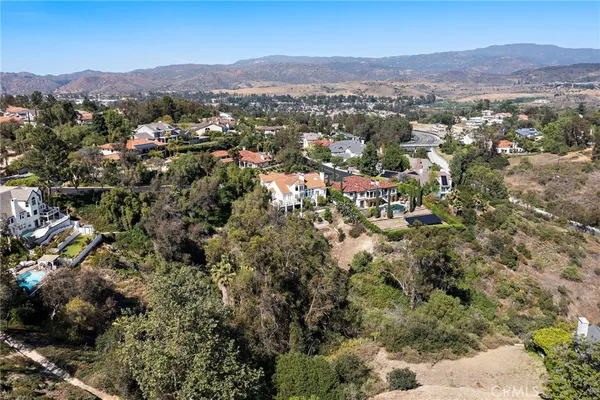 an aerial view of residential house and green space